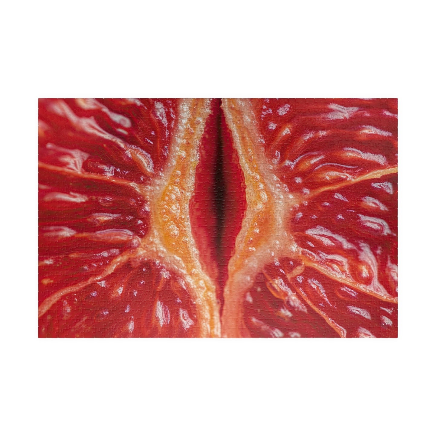 Close-up of a blood orange with visible pith on a white background